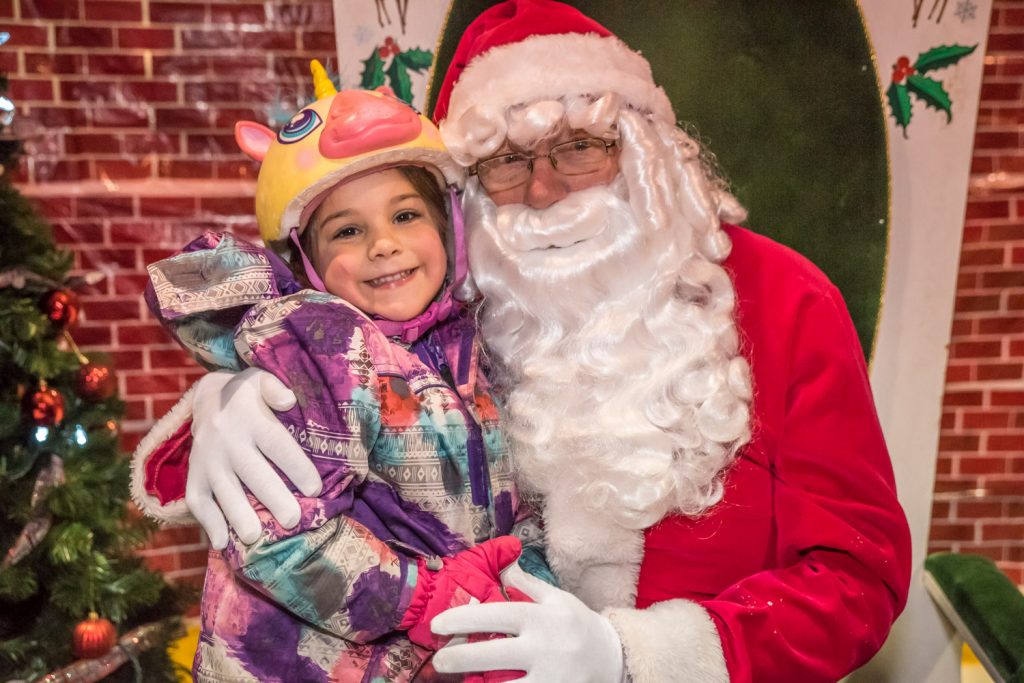 Alexa Agostinho, 5, wore a cute helmet when she met Santa Claus at Rockin' With Santa, the town-organized free family skate on Saturday at the Sun Bowl Arena. (Richard McGuire photo)