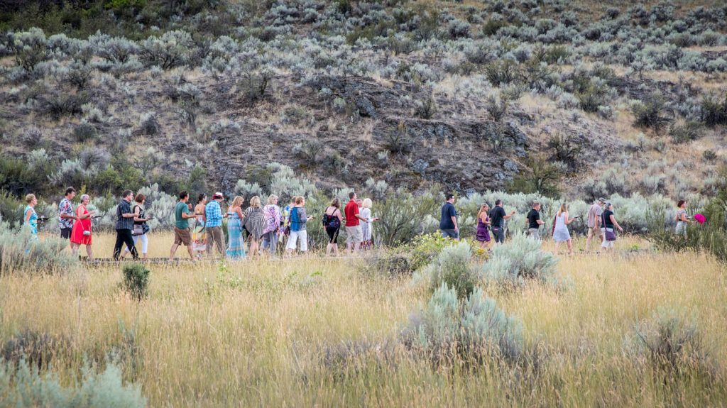 Guests took one of the tours along the boardwalk of the Osoyoos Desert Centre after dinner at Romancing the Desert in August. The tours gave guests an introduction to the desert habitat and animals and plants that live there, but they also stopped for wine tasting and desserts at stations along the boardwalk. (Richard McGuire photo)