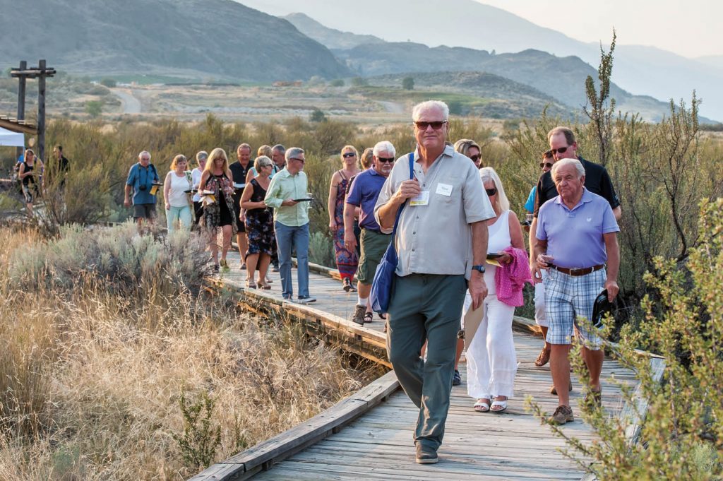 A group tours the desert, sampling wine, during last year’s Romancing the Desert. This year the tour takes place after dinner. (Richard McGuire file photo)