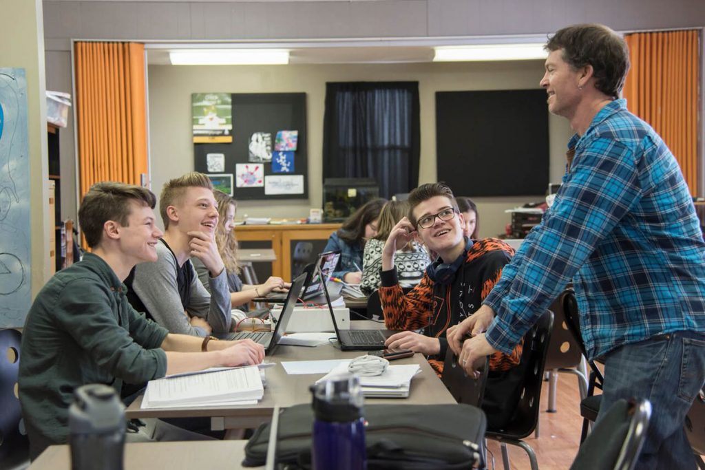 Mentor Jonny Coleshill (right) talks with learners at the Seven Summits Centre for Learning in Rossland. (Jennifer Margaret Photography)