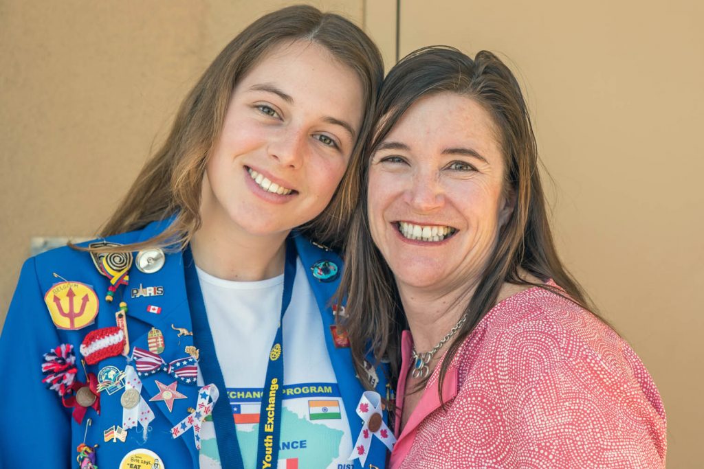 Rotarian Karen Hawitt (Leigh), right, has taken exchange student Camille Buisson under her wing. Buisson's jacket is covered with pins she's obtained from other Rotary exchange students. (Richard McGuire photo)