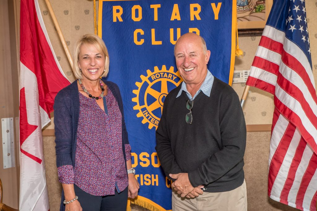 Jim Wyse, the owner of Burrowing Owl Estate Winery, a conservation and national park supporter, spoke at a recent meeting of the Rotary Club of Osoyoos about the provincial government's land protection plans that would include two areas of national park reserve. At left is Marieze Tarr, Rotary president. (Richard McGuire photo)