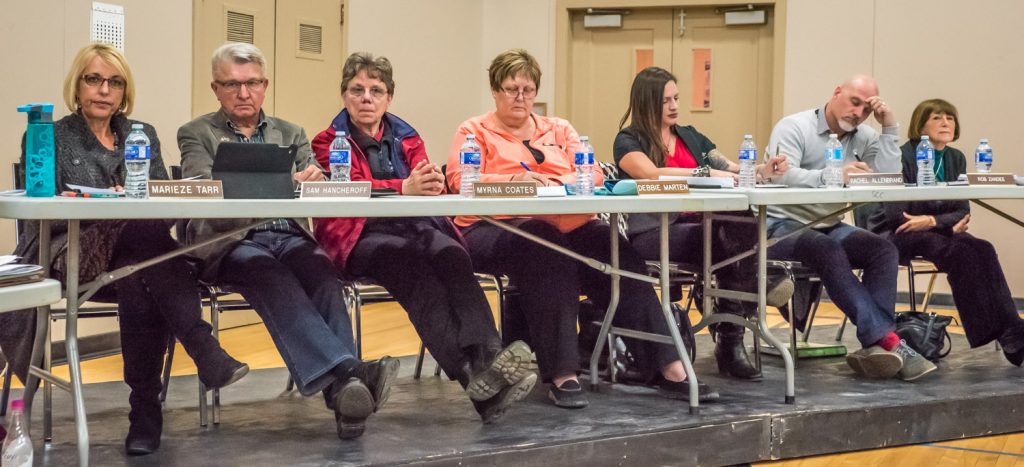 All seven trustees attended Tuesday's consultation this time. From left are Marieze Tarr (chair), Sam Hancheroff, Myrna Coates, Debbie Marten, Rachel Allenbrand, Rob Zandee and June Harrington. Hancheroff was absent at the February meeting. Attendees took note of the trustees' body language for clues on who was listening and who wasn't. (Richard McGuire photo)