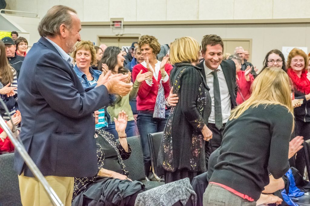 Martha Collins expresses appreciation to Rob Fleming, NDP education critic, after he gave some strong remarks calling for the provincial government to provide adequate funding to school districts so they aren't forced to close schools. (Richard McGuire photo)