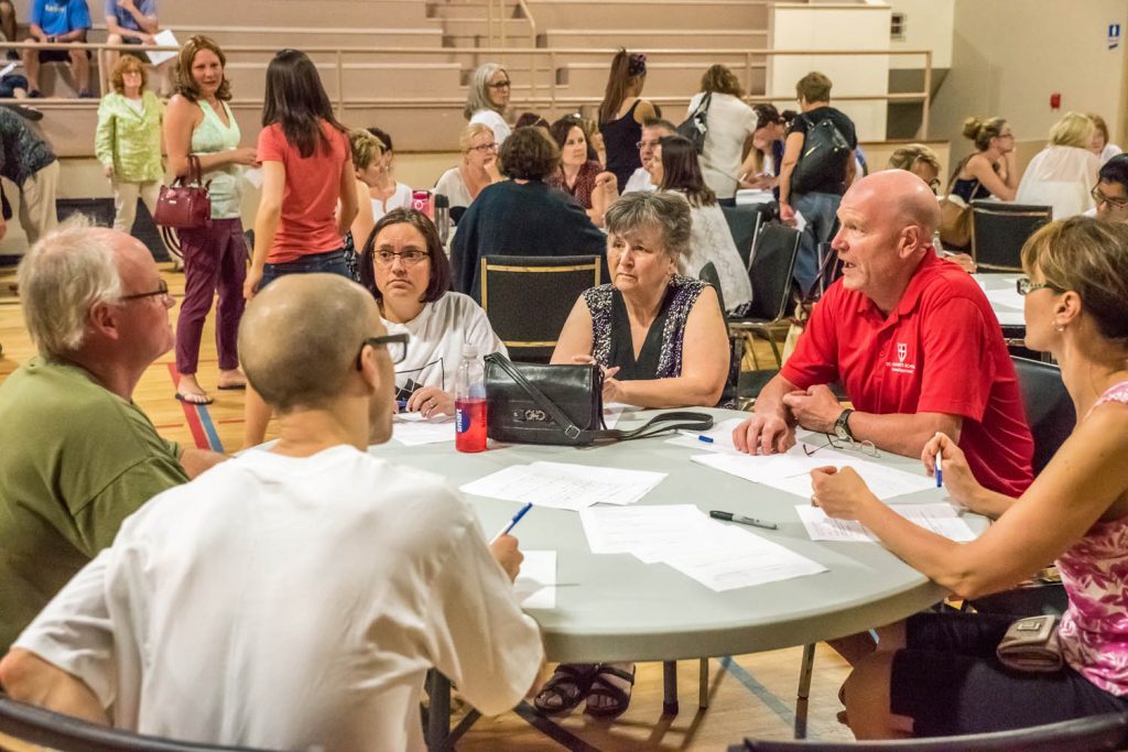 Following the school board's vote in April to close Osoyoos Secondary School, many residents turned their attention to establishing an independent school so Osoyoos students could stay in their own community. At one public meeting, participants broke off into smaller groups for "table sessions" where they discussed what they would like to see in a future Osoyoos community school. (Richard McGuire photo)
