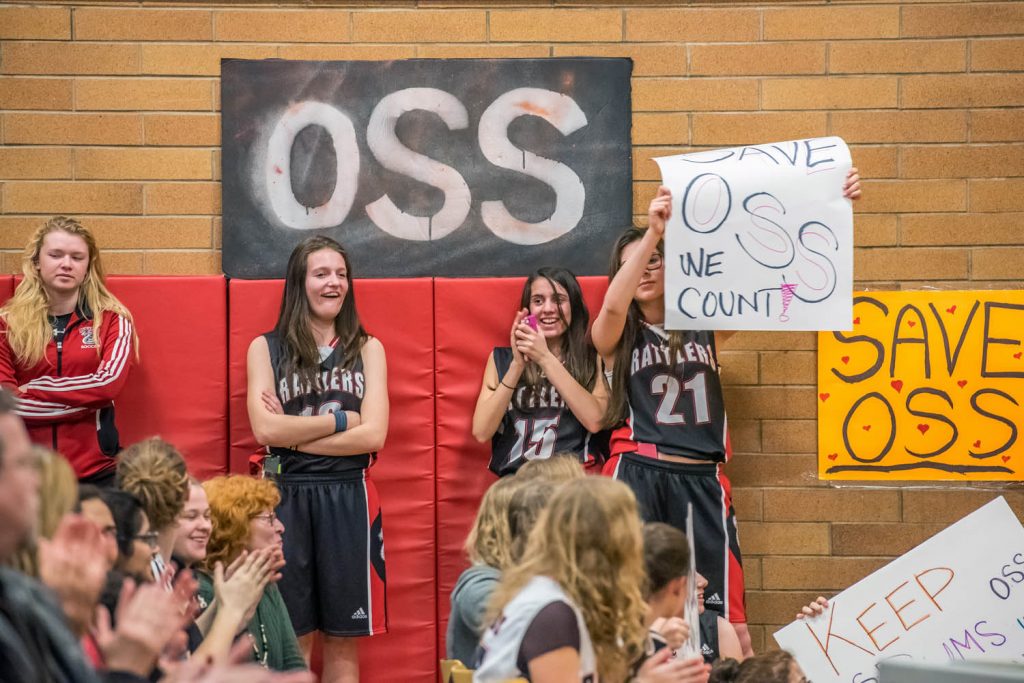 Students hold up signs calling for Osoyoos Secondary School to be kept open last February when the school was threatened with closure. The province eventually provided funding to keep rural schools open, but the funding system is under review. Town council reaffirmed Monday it is committed to ensuring rural schools like OSS remain open as the Ministry of Education is undertaking a review of current practices and funding models for rural education in B.C. (Richard McGuire file photo)