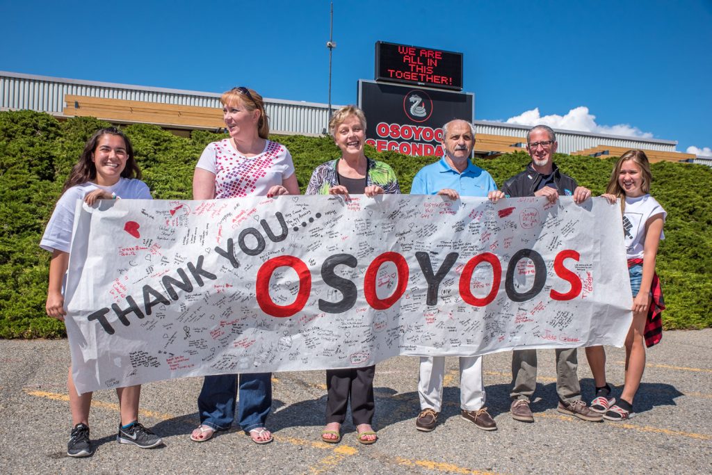 Students of the Osoyoos Secondary School senior girls soccer team wanted a way to thank the Osoyoos community for its support during recent difficult months, so they decided to do a think you banner, signed by students and others. Last week they presented it to Osoyoos town council and it will be put on display at town hall. Students Natalia Ibanez (left) and Julianna Riznek (right) were organizers. From left are Ibanez; Brenda Dorosz, chair of Save Our Schools committee; Mayor Sue McKortoff; Coun. Jim King; Coun. Mike Campol; and Riznek. (Richard McGuire photo)
