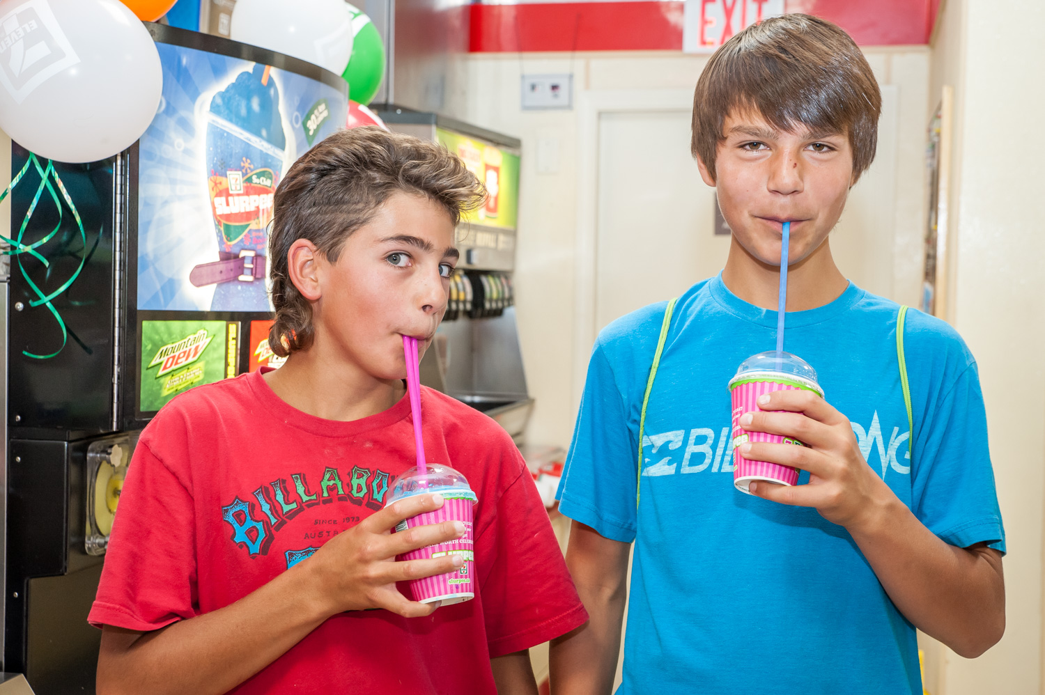 Mason Holz (left) and Brandon Della Paolera cooled off on a hot day Friday with free Slurpees from Osoyoos 7-Eleven. The store was giving away 1,500 12 oz. Slurpees across Canada Friday to mark its 45th birthday. Della Paolera had a minor case of brain freeze, but it was worth it. (Richard McGuire photo)