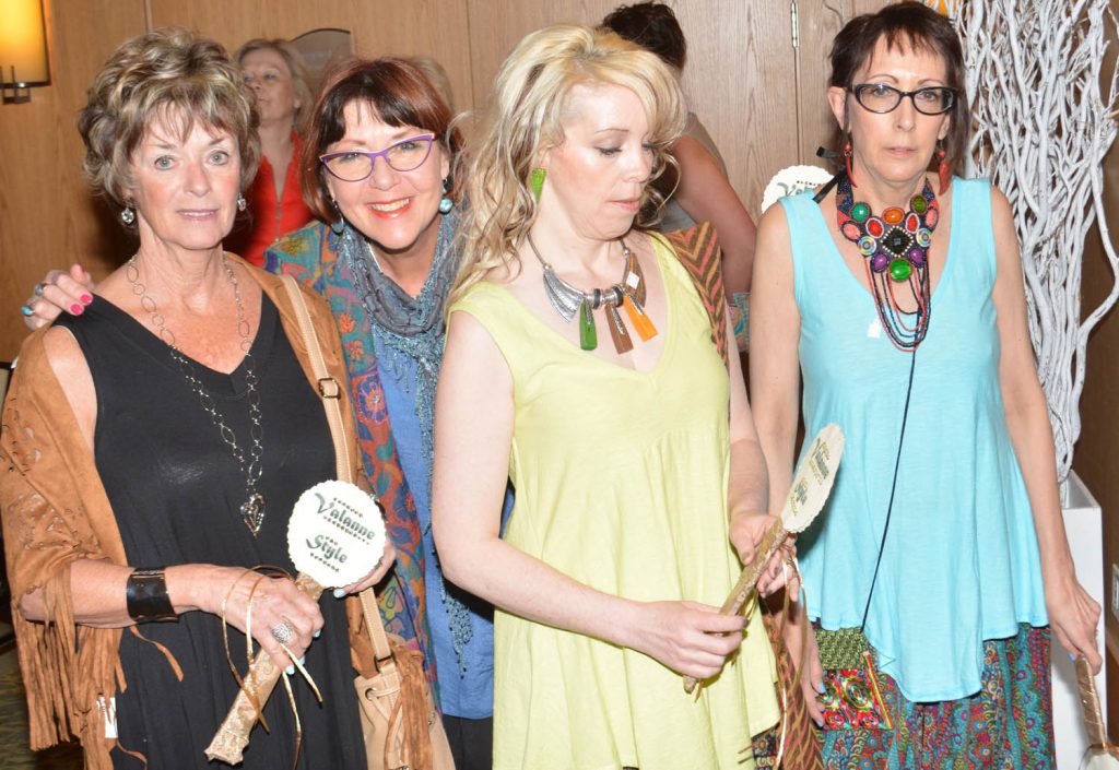 Four ladies wait to strut their stuff, from left: Sherrie Bridden, Valerie Hopp, Victoria Scott and Mo Walker representing Valanné Style. (Lyonel Doherty photo)