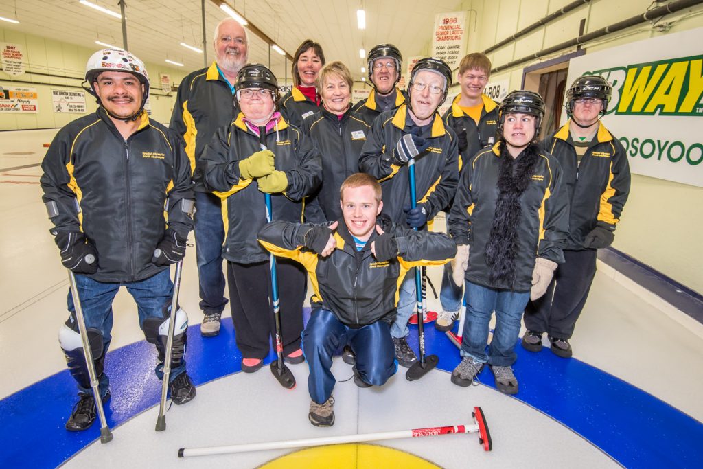 Two South Okanagan Special Olympics teams competed in an annual mini bonspiel in Oliver on Saturday. They faced a team from Princeton. Pictured here (back from left): Mike Ryan (coach), Megan Wegner (coach), Wayne Bierbaum, Kyle Sanderson and Tom Francis. Middle row from left: Alberto Holz, Angela Flannigan, Roberta Dodge (head coach), David Causley, Alysha Thomsen. Front: Barnabas LaFlamme. (Richard McGuire photo)