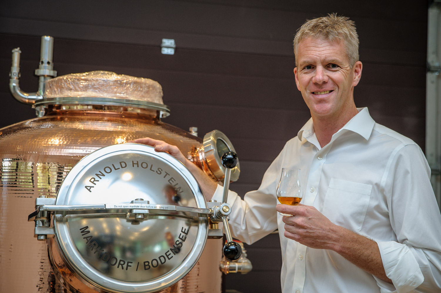Grant Stevely shows the copper German-made Holstein still that will produce spirits at the Dubh Glas Distillery. (Richard McGuire photo)