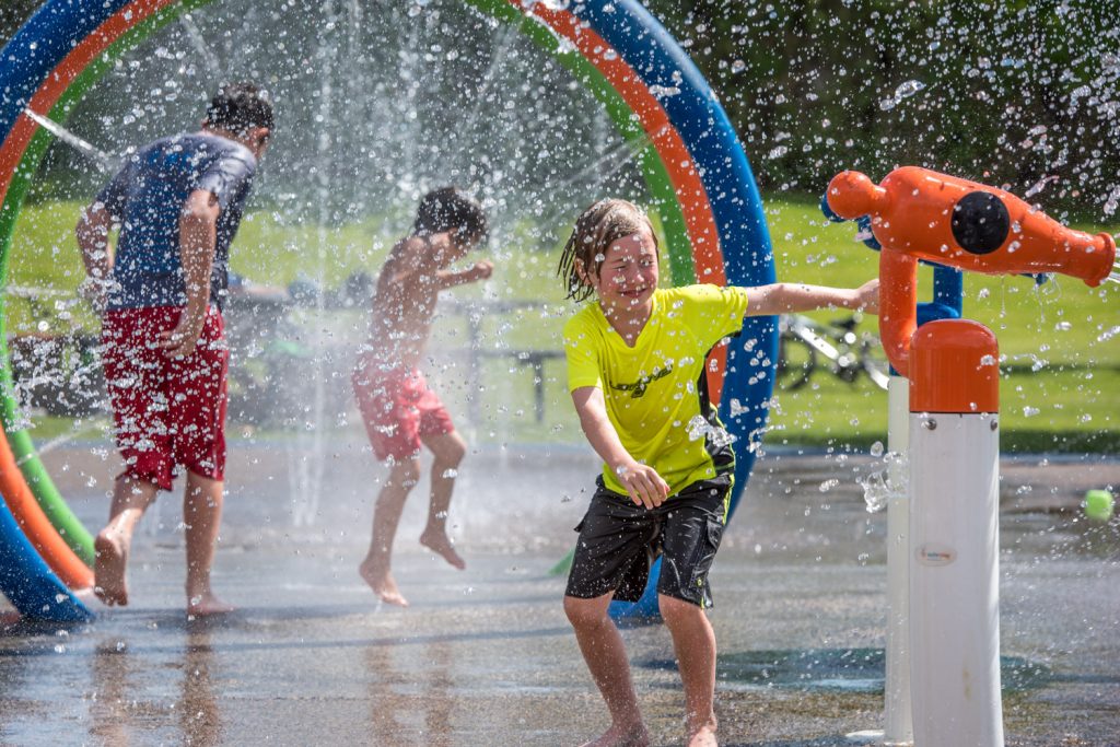 As temperatures climbed into the 30s on Saturday, the Osoyoos Splash Park was a popular spot for kids of all ages. Finn Collins, 8, at right braces for spray before firing a water cannon. Collins, from Seattle, was visiting Osoyoos for the U.S. Memorial Day long weekend. The splash park opened for the season just prior to Canada's May Long weekend a week earlier. The Environment Canada forecast is for a mixture of sun, cloud and rain and temperatures in the high 20s for the rest of this week. (Richard McGuire photo)