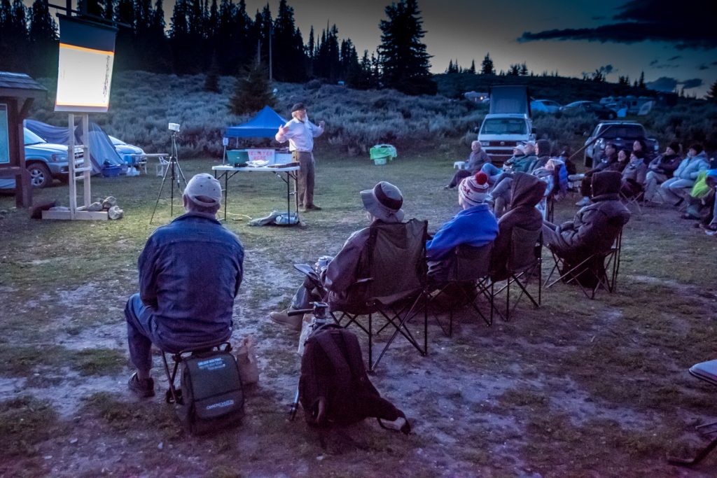 Don Gayton, a consulting ecologist and expert on the effects of fire, gives a talk at the Mount Kobau Star Party Friday evening as it begins to get dark. After his talk, participants gathered around telescopes to look up at the night skies. (Richard McGuire photo)