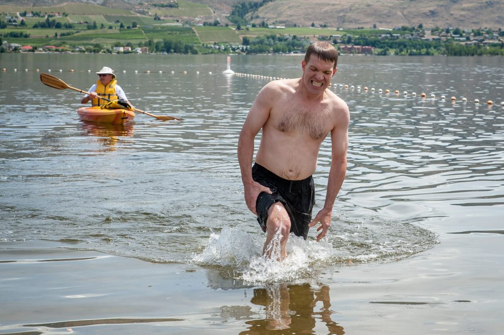 Teacher Peter Gajda recovers from a vigorous swim during the Ironman version of Storm the Wall. (Richard McGuire photo)