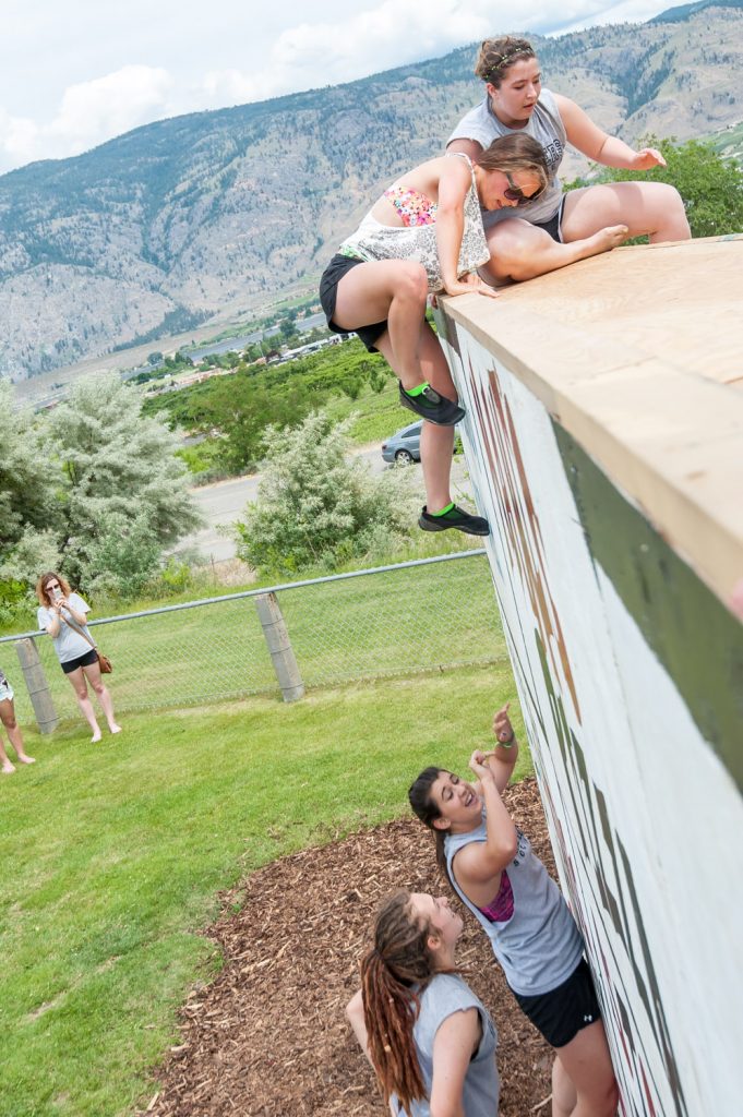 Students above and below the wall helped their teammates complete the climb. (Richard McGuire photo)
