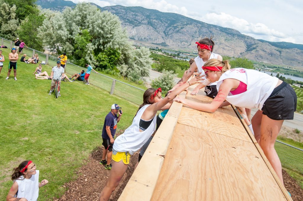 Students above and below the wall helped their teammates complete the climb. (Richard McGuire photo)