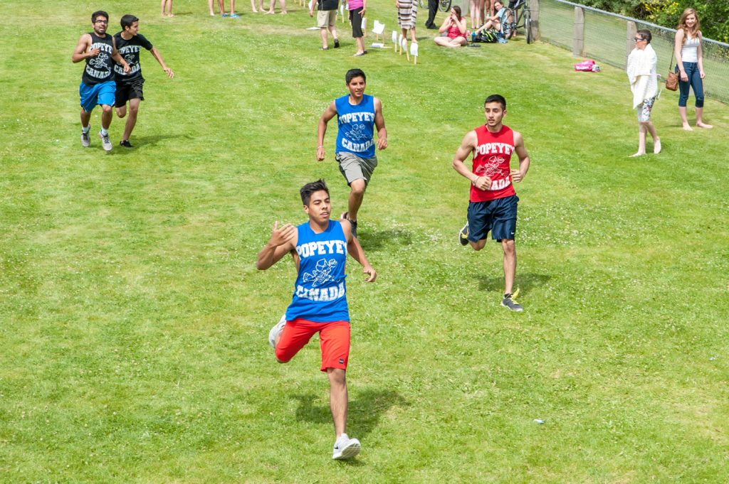 A team runs towards the wall in the Storm the Wall event. (Richard McGuire photo)