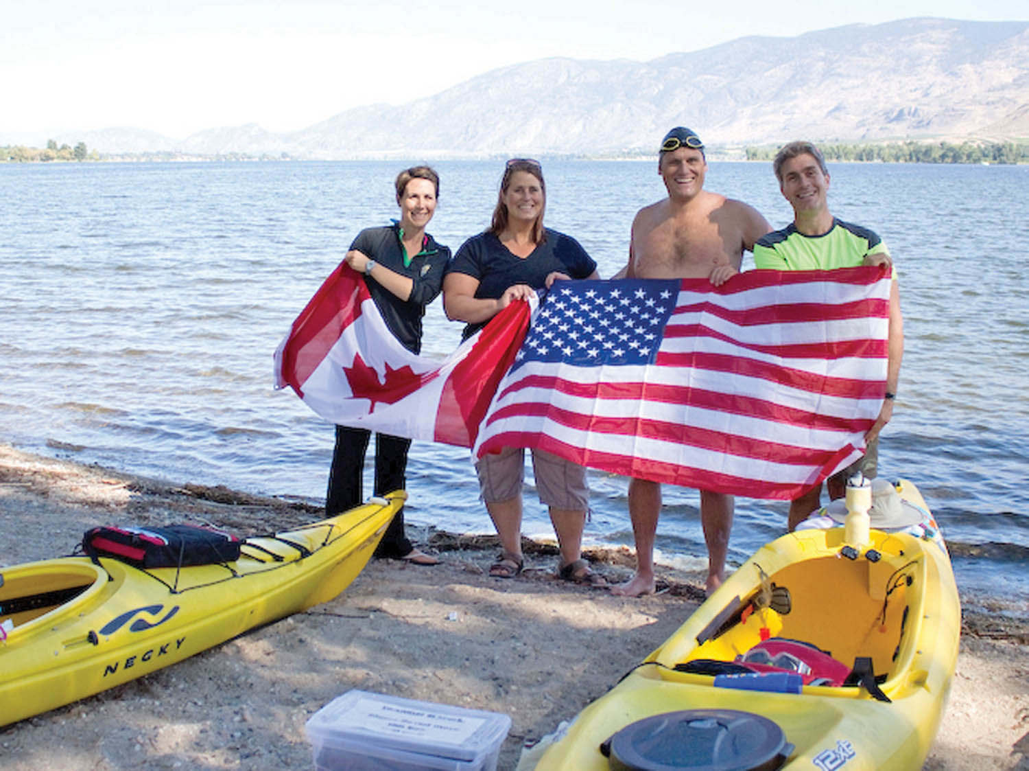 Swimmer Paul Duffield (second from right) was supported on his swim by kayakers Ashley Russo (left) and Phred Martin (right) and his wife Angelique Duffield. (Photo supplied)
