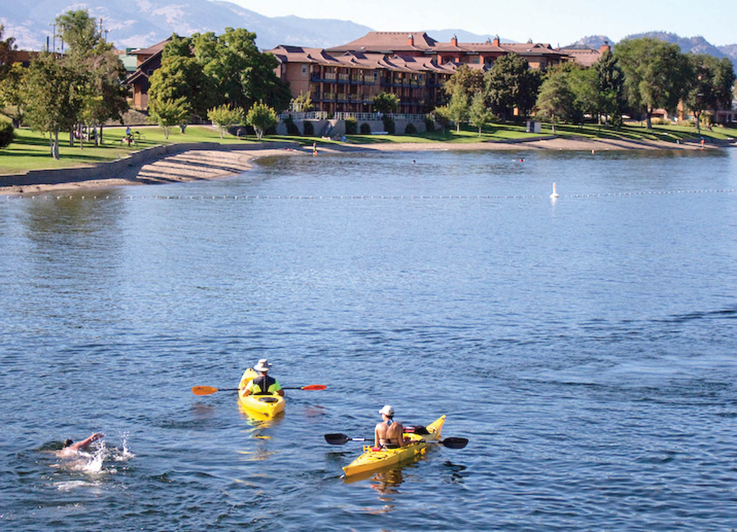 Duffield, accompanied by kayakers Ashley Russo and Phred Martin, completes the final lap to Gyro Park in Osoyoos. (Angelique Duffield photo)