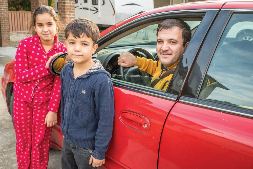 Mohamad Rabee Tabanjat has recently obtained his driver's license, giving his family more independence. With him are his daughter Fatima and son Samer. (Richard McGuire photo)