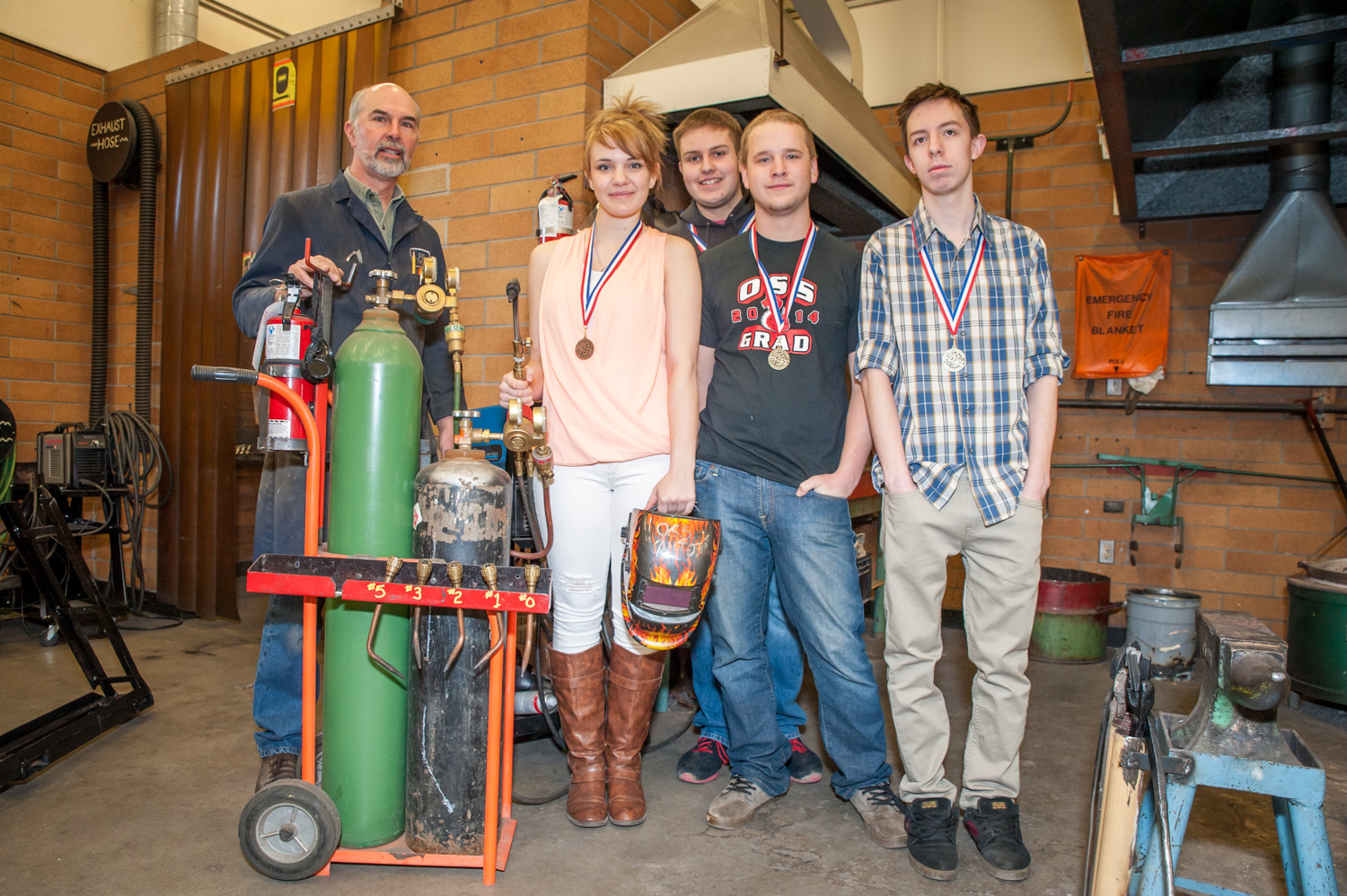 Six students from Osoyoos Secondary School attended a trades competition against students from other Okanagan Schools Friday. Three took gold medals and three took bronze. From left are Ivor Langley, tech instructor, Kelsey Gorgichuk, Shayden Stark, Kye Cowen and Dalton Rose. Not shown are Zac Beaudoin and Steven Lindsay. (Richard McGuire photo)