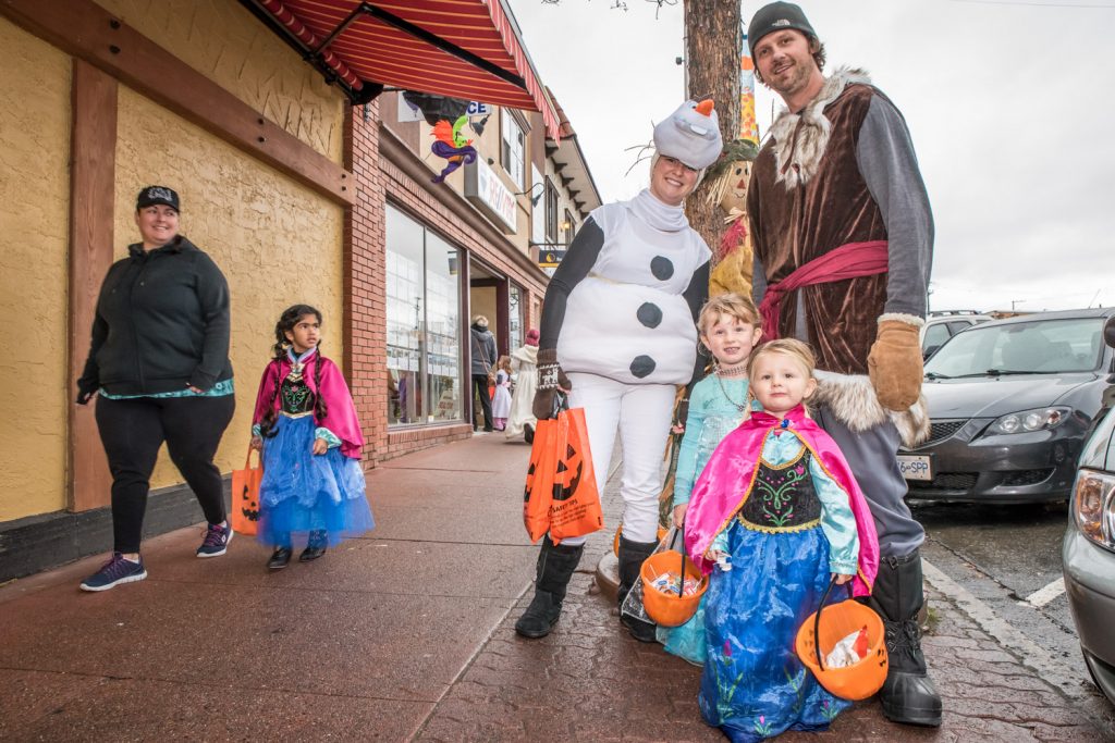 Trick or Treat Main Street was a popular event for families in Osoyoos on Halloween. Mother and father Michelle and Mitch Fritz took out their daughters Vienna (middle) and Kinsley (front) to visit downtown businesses. (Richard McGuire photo)