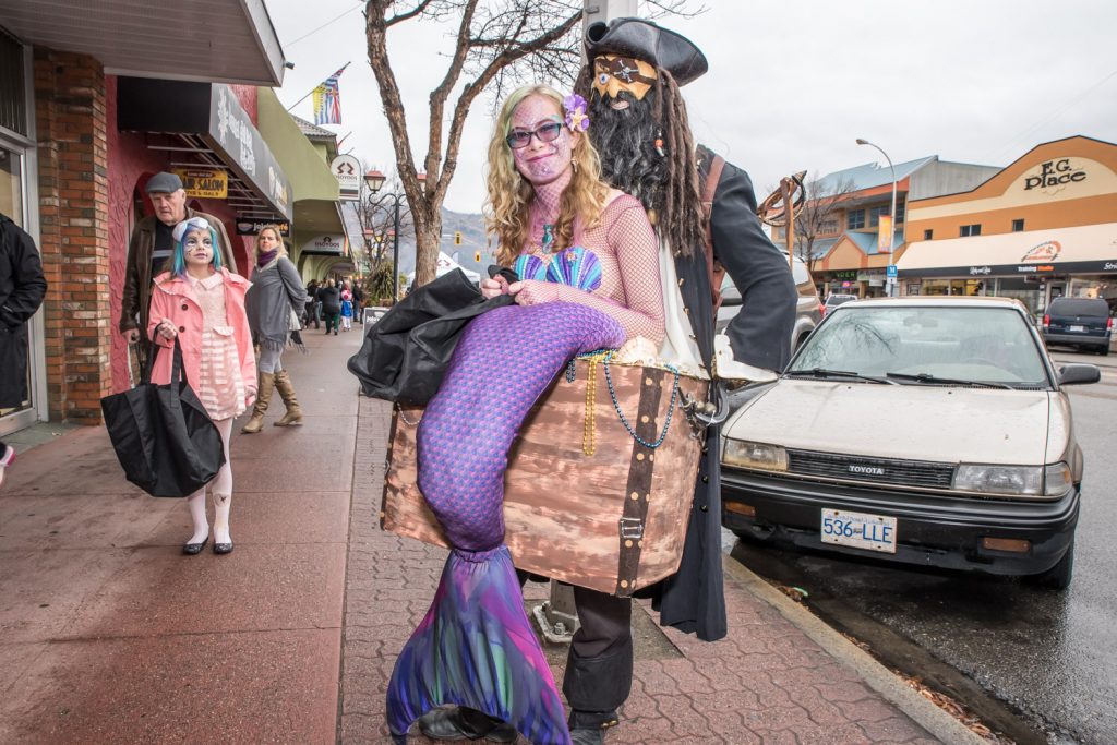 Jade Heatley, of Osoyoos, dressed as a mermaid, carried around by a pirate, who didn't have much to say. Trick or Treat Main Street in downtown Osoyoos drew participants of all ages. (Richard McGuire photo)