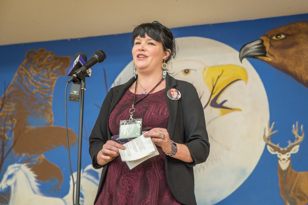 Tiffany Beckedorf, the V-Day Chair, gave opening remarks at the art show on Sunday, International Women's Day. One Billion Rising, she said, is an international call to action based on the statistic that one in three women on the planet will be beaten or raped during her lifetime. (Richard McGuire photo)