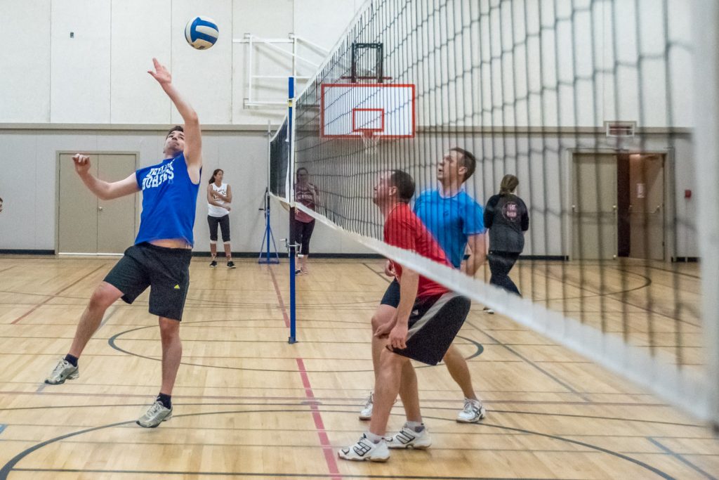 Jonathan Stermescheg (left) of Here Come the Horses prepares to hit the ball as opponents Ryan Dunkley and Kenton Gilchirst of Desert Hills are ready to hit it back. (Richard McGuire photo)