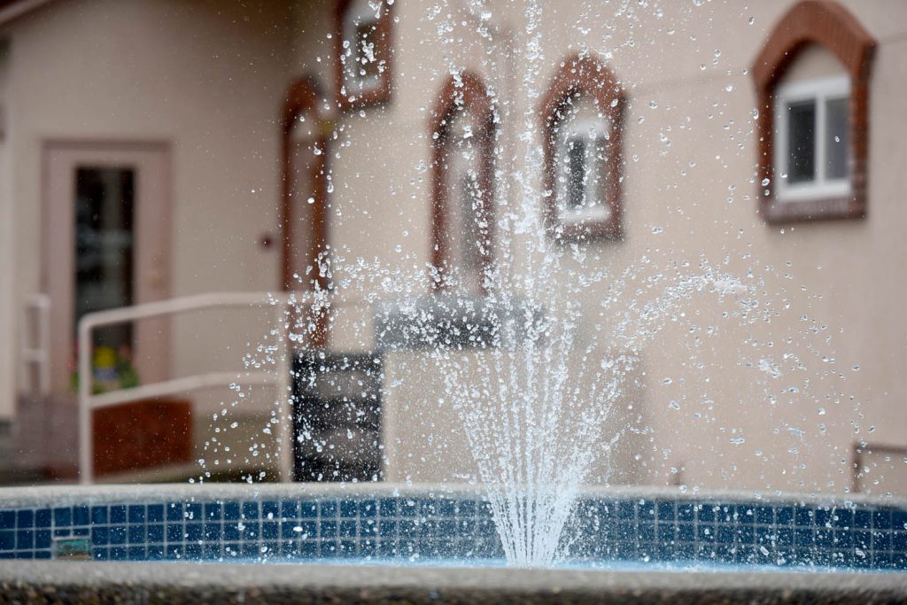 The fountain outside town hall shoots water into the air as councillors inside their chamber discuss a new water bylaw. No waste here though -- this water is recirculated. (Richard McGuire photo)