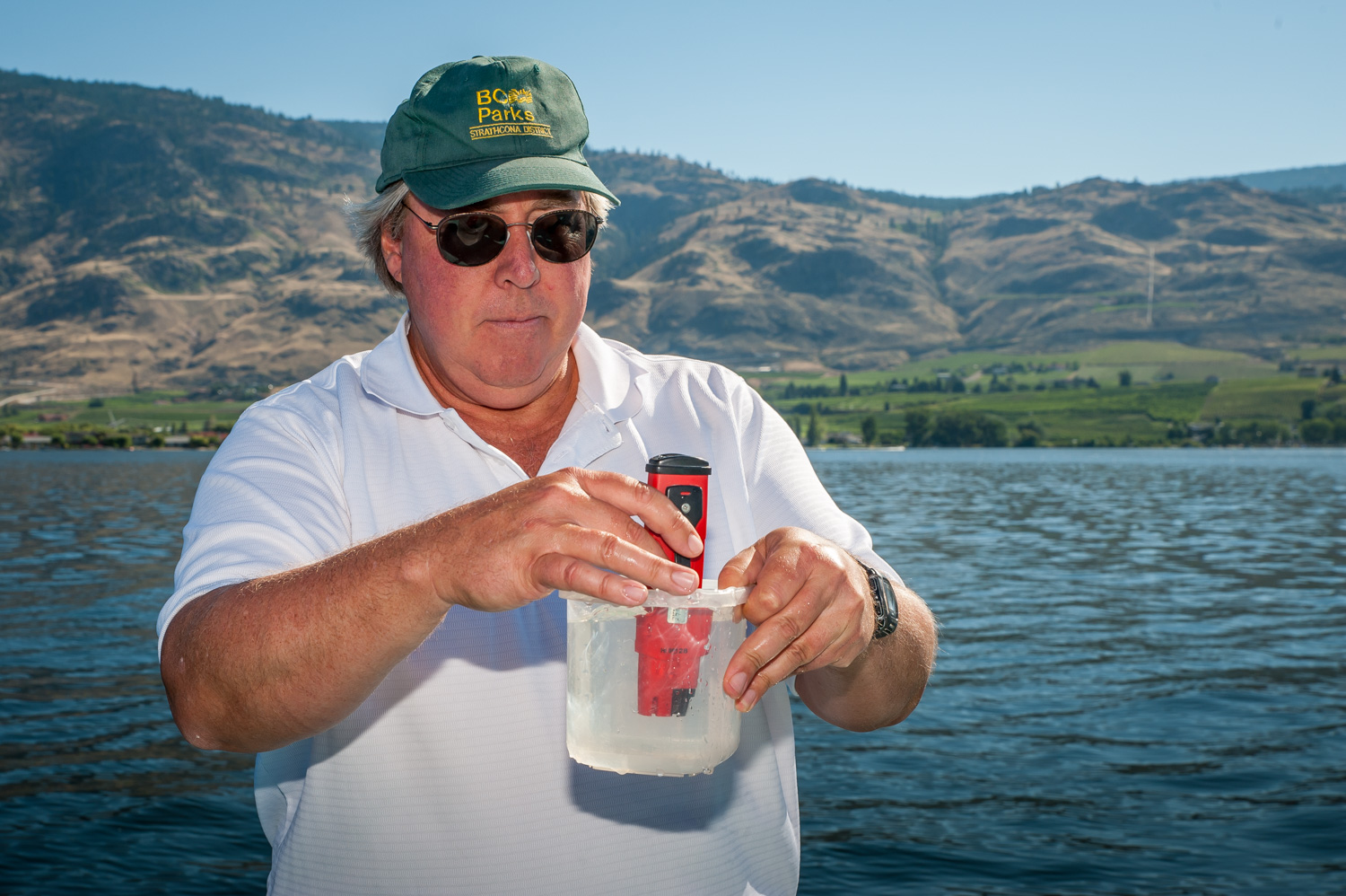 Brian Faltinson measures the pH or acidity of a sample of water collected from a depth of 18 metres. (Richard McGuire photo)