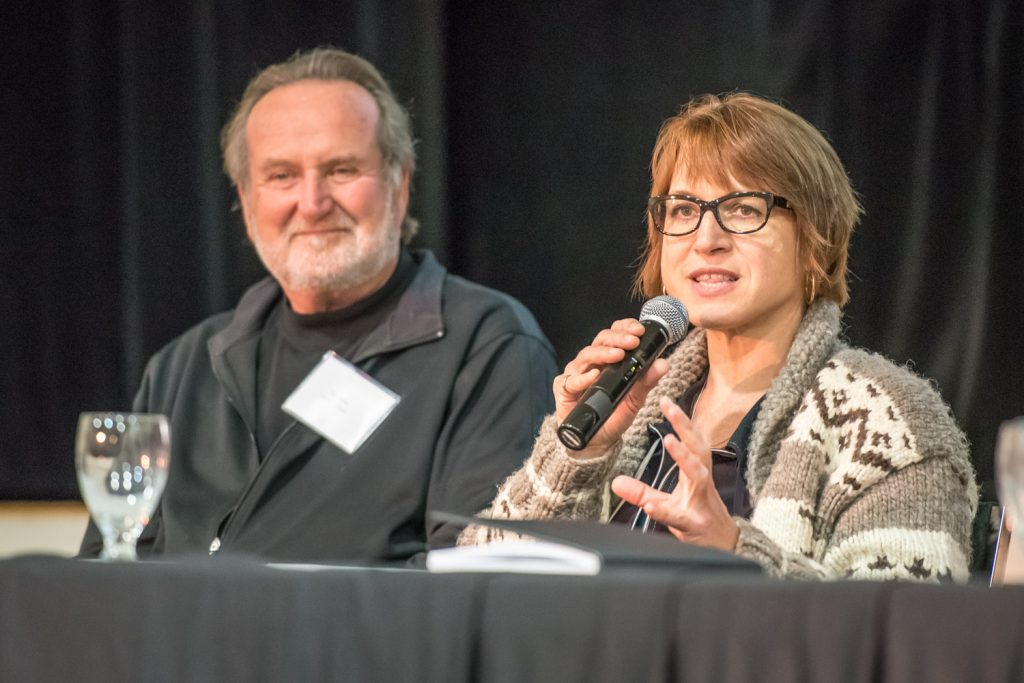 Anna Warwick Sears, executive director of the Okanagan Basin Water Board, speaks on a panel summing up the discussions of the first full day of the Osoyoos Lake Water Science Forum. On the left is Stu Wells, former Osoyoos mayor and former OBWB chair, who co-chaired the forum along with Sears and current mayor Sue McKortoff. (Richard McGuire photo)