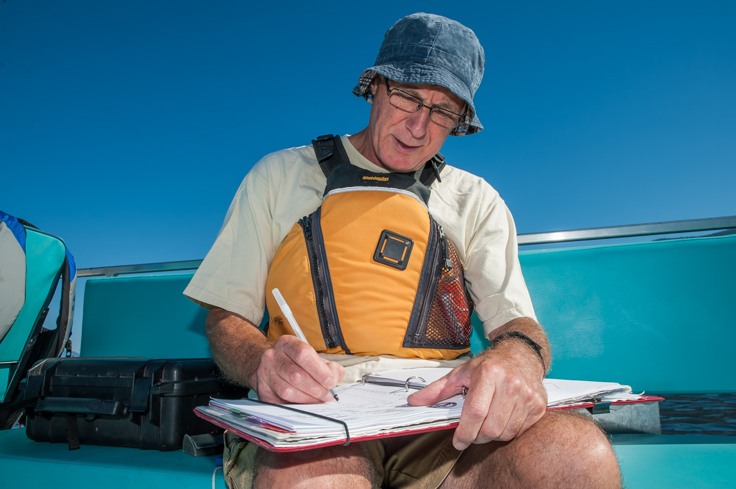 John Gates records data in the log book. (Richard McGuire photo)