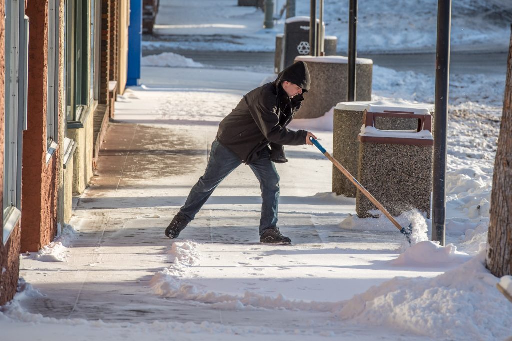 Travis Winter shovels snow from the sidewalk in front of Imperial Office Pro, where he works. The normal mean temperature in Osoyoos in December is around -0.7 C, but this year it’s been down to -4.1 C. It appears this trend has continued into January, though figures aren’t yet available. A difference of a few degrees might not seem like a lot, but it is significant. In normal years, milder weather blows off the Pacific from the southwest to provide some relief from Arctic air, but that hasn’t happened much this winter. (Richard McGuire photo)