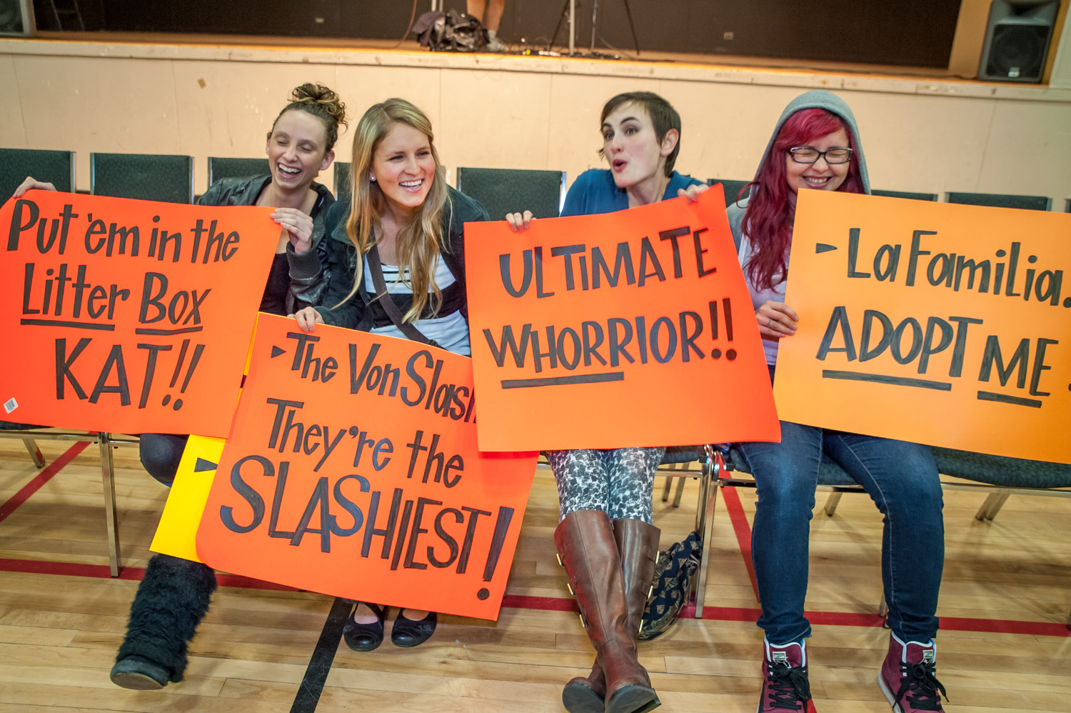These local wrestling fans brought signs to cheer on and insult wrestlers in the show by Big West Wrestling at the Sonora Community Centre on Sunday night. From left are Cheyanne Snyder, Alison Armstrong, Shannon Peltier and Audrey Rose. (Richard McGuire photo)
