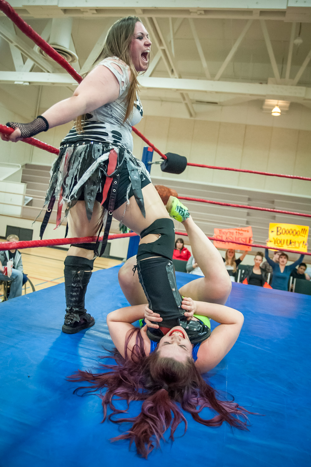 Riea Von Slasher puts a boot to the throat of Kat Von Heez during a performance by Big West Wrestling at the Sonora Community Centre Sunday evening. (Richard McGuire photo)