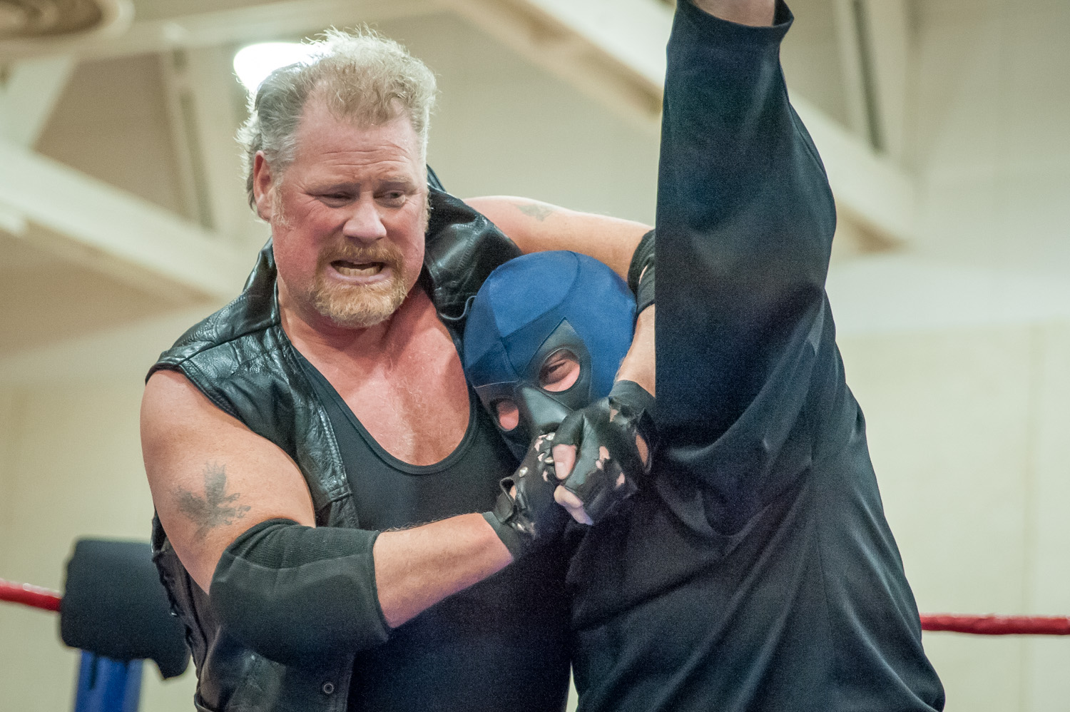 Bruiser Joe (left) puts a choke hold on Mean Machine during a performance by Big West Wrestling Sunday night at the Sonora Community Centre. (Richard McGuire photo)
