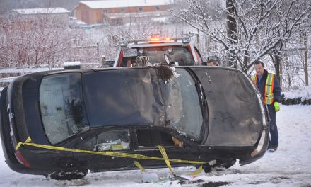 Car rolls into yard after driver hits ice