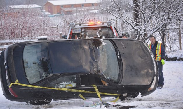 Car rolls into yard after driver hits ice