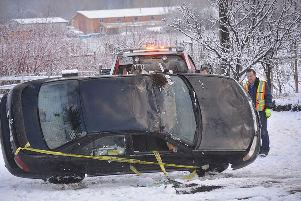 Car rolls into yard after driver hits ice