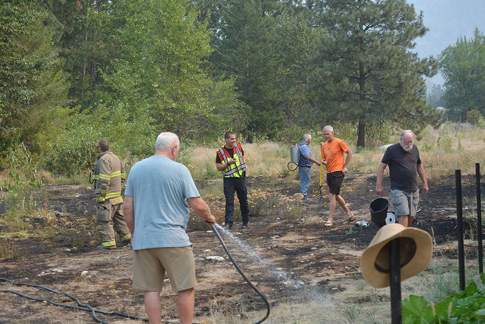 Tool sparks grass fire near homes