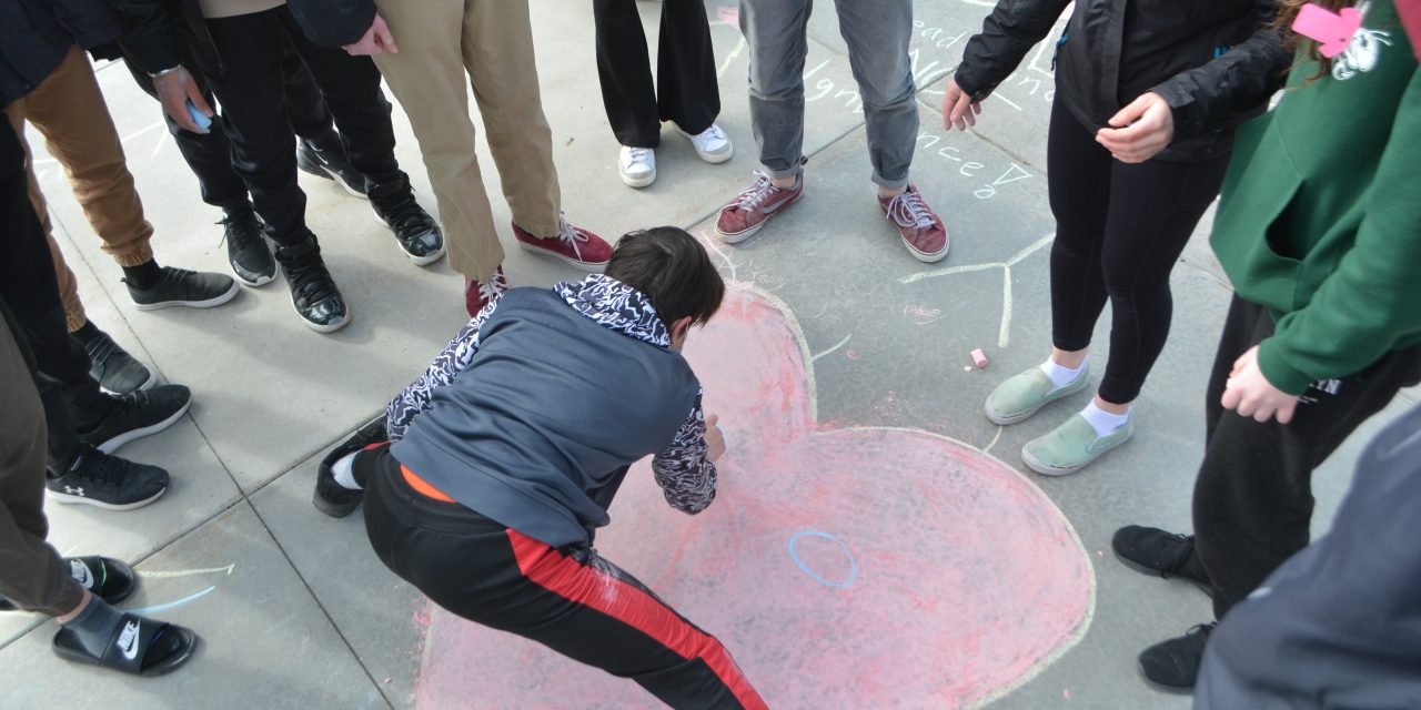Students promote ‘peace chalks’ in Oliver