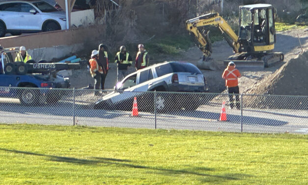 Driver disregards flaggers ends up in a hole