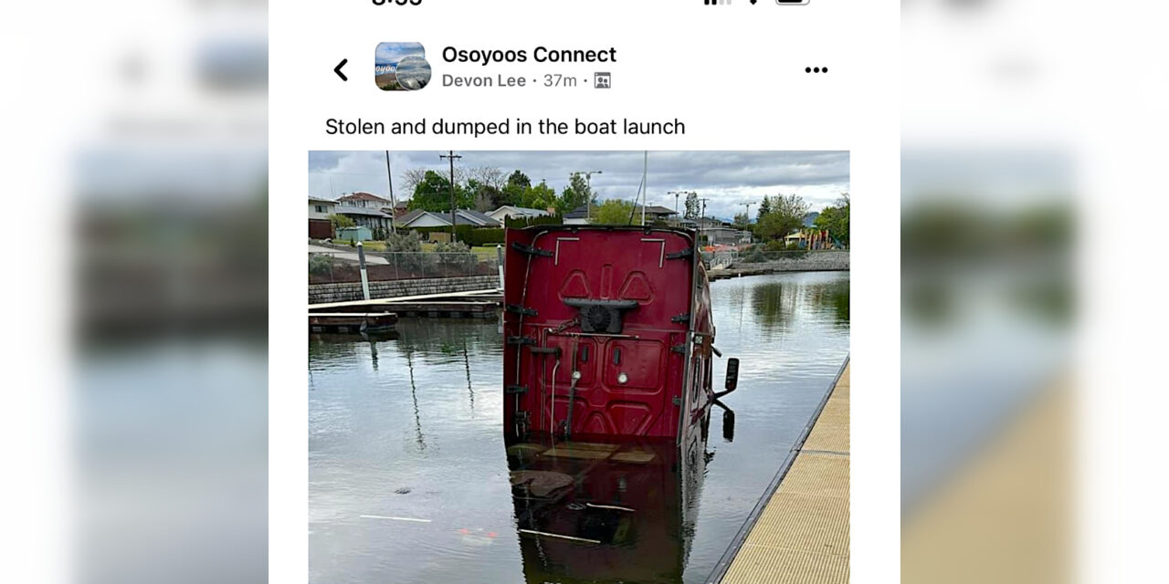 Semi-truck cab semi-submerged at Osoyoos Marina