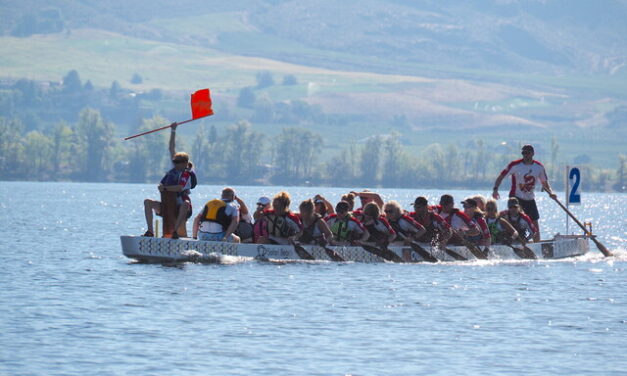 Dragon boaters take to the lake off of Safari Beach