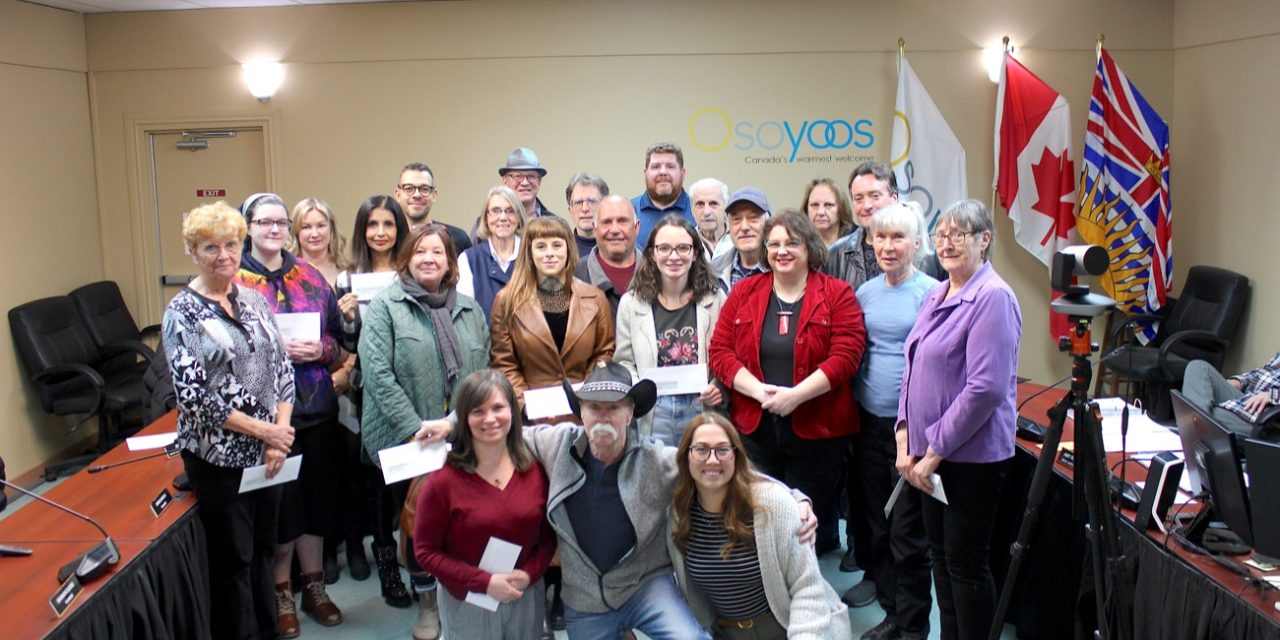 Community groups collect grant funding cheques